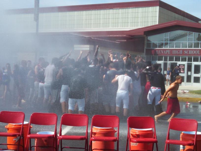 Mount Laurel Fire Department sprays the fall sports teams.