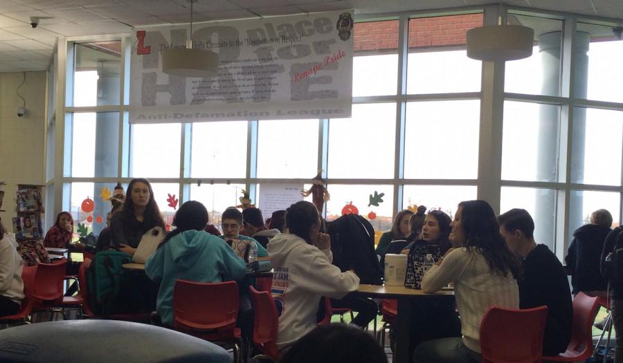 Students eat lunch in the media center as one of of several venues available to them