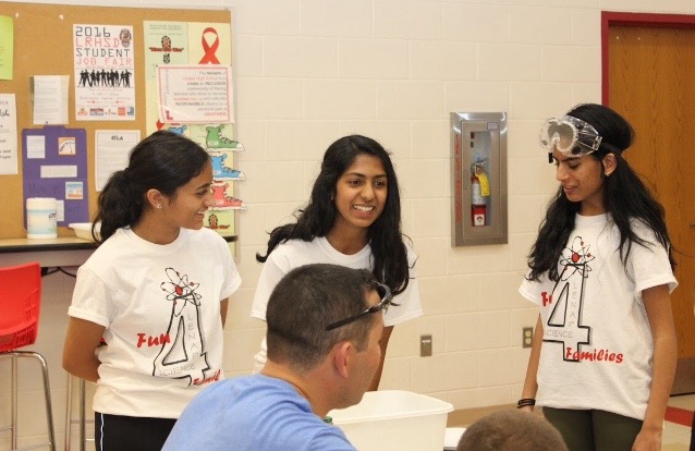 Megha Bharadwaj ('17), Jasmine Philip ('17), and Isabel Chacko ('17) explain the polymer diapers are made up of.