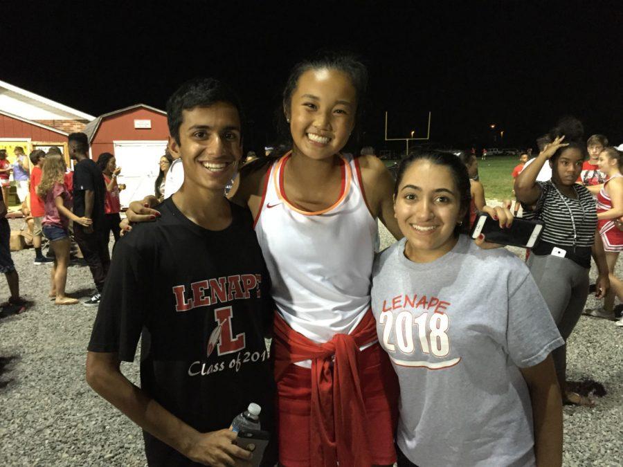 Lenape juniors Kyle Patel, Fuhmay Zhang, and Sakshi Chopra celebrate during halftime