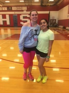 Amanda Smalfus and Sakshi Chopra, Class of 2018, pose for a picture in their 80s gear before the Zumba class begins.