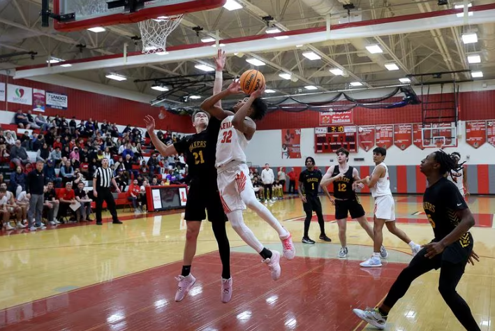 Lenapes Myles Primas gets a shot up against Moorestown